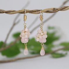 These raspberry earrings are romantic and sweet! Made of gold filled with a silver hook, these bohemian inspired earrings have such unique details that make them unlike anything else! They feature gold filled wire wrapping, gold filled beads, and a cluster and drop of rose quartz gemstones. They look gorgeous matched with casual jeans and a tee or a summery dress. Also they make for lovely bridesmaid earrings for that perfect pop of light pink.Materials:Stone: rose quartzMetal: gold filled, silv Nickel Free Dangle Earrings For Bridesmaids, Handmade Dangle Earrings For Bridesmaids, Delicate Cluster Drop Earrings As Gift, Dainty Wire Wrapped Earrings For Wedding, Dangle Earrings For Bridesmaid Gift, Feminine Earrings For Wedding And Mother's Day, Delicate French Hook Earrings For Gift, Wedding Crystal Dangle Earrings Wire Wrapped, Delicate Dangle Jewelry With French Hook