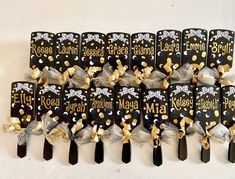 a group of black and gold hair clips with bows on them that say, rosedale garden club