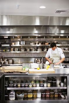 a chef preparing food in a commercial kitchen