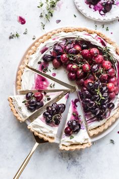 a pie topped with cherries and whipped cream