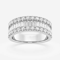 a white gold ring with three rows of diamonds on the sides and two rows of baguetts in the middle