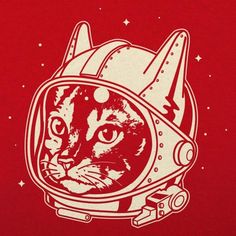 a cat wearing an astronaut's helmet on top of a red t - shirt