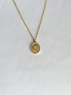 A golden celestial style necklace that's so stunning on and matches everything. An absolute essential in every jewelry collection. Our chains are 100% stainless steel and hypoallergenic so they won't rust, tarnish, or turn your neck green. - Water resistant - Lobster clasp closure - Stainless steel pendant + chain - Select desired size at checkout Trendy Gold Jewelry With Sun Design, Minimalist Gold Charm Necklace With Sun And Moon Design, Gold Dainty Sun Design Charm Necklace, Minimalist Gold Necklace With Sun And Moon Design, Minimalist Gold Necklace With Sun Design, Dainty Gold Charm Necklace With Sun Design, Dainty Gold Charm Necklace With Sun And Moon Design, Sun Moon Necklace, Sun And Moon Necklace