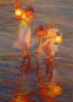 an image of two people in the water with lights on and one person holding a lantern