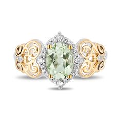 a ring with an oval green stone surrounded by two tone gold and white diamond accents