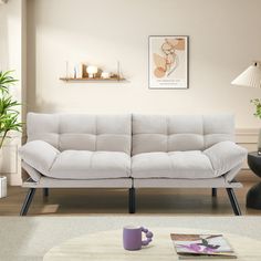 a living room scene with focus on the couch and coffee table