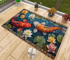 a colorful rug with a fish and flowers on it in the middle of a wooden floor