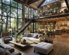 a living room filled with lots of furniture next to tall windows on top of a wooden floor