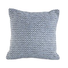 a blue and white pillow on a white background