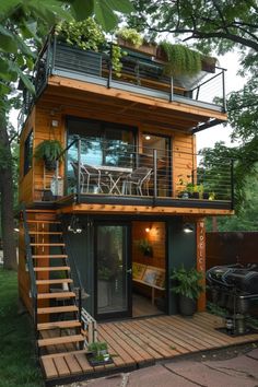 a small wooden house with stairs leading up to the upper level and balcony above it