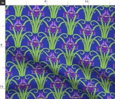 purple and green flowers with swirls on a blue background, in the middle of a ruler