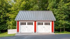 two red and white garages in front of trees