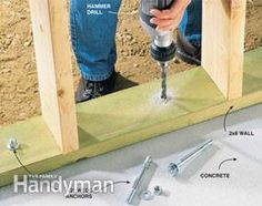 a person using a drill to fix a hole in the wall with screws and nails