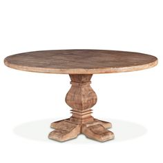 a round wooden table with two pedestals on the top and one leg raised up