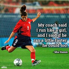 a woman kicking a soccer ball on top of a field with a quote about her