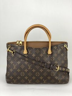 Pre-Owned 100% Authentic Louis Vuitton Pallas MM Brown/Havane Tote  RATING: B-..very good, well maintained, shows minor signs of wear MATERIAL: monogram canvas, leather HANDLES: leather , has some light  stains and marks, little darker where held COLOR: brown, havane EXTERIOR: bottom studs show sign of use ODOR: no HARDWARE: golden, has scratches INTERIOR: Brown microfiber, clean DATE CODE: SD0164 MEASUREMENTS: H 10.2'' x L13.4 '' x W 5.1'' INCLUDED: *LV Removable Adjustable  monogram strap 25-2 Business Monogram Canvas Bag With Double Handle, Business Double Handle Monogram Canvas Bag, Classic Monogram Canvas Satchel With Double Handle, Business Shoulder Bag In Monogram Canvas With Double Handle, Business Shoulder Bag With Detachable Handle In Monogram Canvas, Business Shoulder Bag With Detachable Handle And Monogram Canvas, Formal Double Handle Monogram Canvas Satchel, Business Monogram Canvas Satchel With Detachable Strap, Double Handle Monogram Canvas Satchel With Removable Pouch