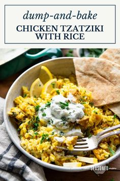 a bowl filled with chicken and rice next to pita bread