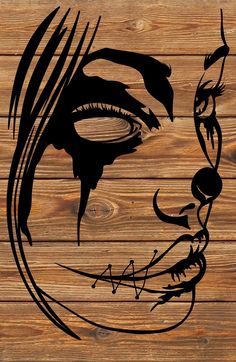 a drawing of a man's face on wooden planks with the word,