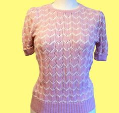 Great 1980s version of a 1950s style knit top in a light pink and white chevron pattern. Top is in new condition, still has original tags. See photos for details. Label- Butte Size- Label says size 12, is more of a size 8/ Small-Medium Measurements: Bust: 33in Waist: 34in Length, hem to shoulder: 23   Want to see more Vintage Clothes? Click here:  https://www.etsy.com/shop/ChatsworthVntg?ref=seller-platform-mcnav§ion_id=5817130 Thanks for viewing my item!  Before you leave - don't forget to Favorite my store to be updated on sales. Please review photos and descriptions. I am happy to answer any questions and provide additional measurements and/or photographs prior to your purchase, just send me a message. Vintage items have been used and usually have signs of wear, tarnish, or patina. That Fitted Textured Knit Pink Top, Fitted Pink Textured Knit Top, Retro Textured Knit Sweater For Spring, Retro Textured Knit Spring Sweater, Vintage Knit Crew Neck Top, Vintage Crew Neck Knit Top, Retro Knit Tops For Spring, Retro Textured Knit Spring Tops, Retro Textured Knit Crew Neck Top