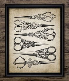 an old fashioned frame with scissors on it