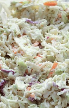 a bowl full of coleslaw salad with carrots and celery