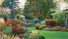 the garden is full of colorful flowers and trees