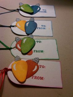 four tags with different colors and designs on them