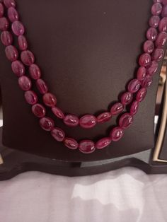 AAA 478 Carat Fine Quality Natural Ruby Smooth Plain 20 Inch Necklace Adjustable code Stone :Natural Ruby Shape :- fancy oval Necklace - 20 inch 2 line string Size :- 5x7mm to 10x12mm Weight :- 478 carat Polish :- Handmade Purity :- 100% Natural Gemstone color - red makes a great gift for your loved ones. It is known as the 'love stone' as the message it emits is the strong vibration of unconditional love, joy, warmth and healing. As quartz crystals are profound amplifiers of energy, it may help Handmade Oval Spiritual Beaded Necklaces, Traditional Oval Handmade Necklaces, Traditional Oval Handmade Necklace, Traditional Handmade Oval Necklace, Oval Beaded Spiritual Necklaces, Traditional Oval Necklaces With Polished Beads, Spiritual Oval Beaded Necklace, Spiritual Beaded Oval Necklace, Oval Gemstone Beads For Jewelry Making