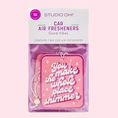 a pink package with an air freshener on it's front and the words you make