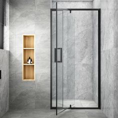 a walk in shower sitting inside of a bathroom