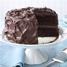 a birthday cake with chocolate frosting on a plate