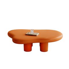 an orange coffee table with a metal object on it's top and two legs