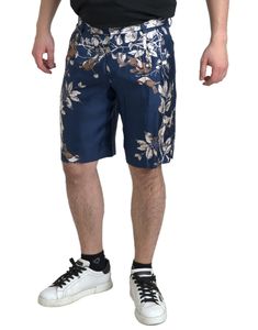 Step into spring with the elegance of these Dolce & Gabbana Bermuda shorts, a gorgeous fashion statement new with tags. Engineered from luxurious dense silk, these shorts feature a vivid floral print, perfect for those seeking both comfort and style. Tailored in Italy, the item ensures a snug fit with its convenient zipper and button closure. The blue hue harmonizes with the floral design, enhancing your ensemble with a touch of nature’s charm while the subtle logo details add an unmistakable to Luxury Bermuda Shorts For Men, Luxury Casual Bermuda Shorts With Built-in Liner, Luxury Men's Bermuda Shorts, High-waisted Denim Bermuda Shorts In Blue, Luxury Knee-length Bermuda Shorts With Pockets, Bermuda Swim Trunks With Built-in Shorts, Denim Bermuda Shorts With Built-in Shorts In Blue, Dolce And Gabbana Blue, Shirt Designs For Men