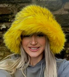 💥My hats are made by me and shipped to you WITHIN 3 days of receiving your order!Welcome to my fluffy shop where absolutely everything is made by me in England!  So because I make everything, any head size can be accommodated for, no worries at all! The standard size will fit heads approx 22- 23.5 inches, but if you want me to make a larger or smaller one, please add a measurement when ordering. Or message me your size.A beautiful super luxury faux fur this stunning bright canary yellow, with black tips. Super Fluffy! Hat fits heads approx 21.5 -23.5 inches but I can make one larger or smaller if you like. The added bonus with my hats is that the polar fleece lining is water resistant, so great if caught in a downpour! All handmade by me in Lancashire! Yellow Festival Hat, Cheap Yellow Novelty Hat, Fun Brimmed Mini Hats For Winter, Fun Winter Festival Hats, Winter Festival Beanie Mini Hat, Trendy Yellow Brimmed Hat, Yellow Winter Hats, One Size Fits Most, Fun Yellow Hat For Festivals, Fun Yellow Hat For Festival