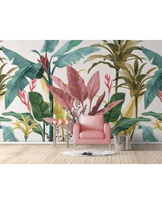 a pink chair sitting in front of a wall mural with tropical leaves and flowers on it