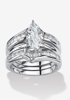 a white gold engagement ring set with an oval cut diamond and baguettes on the sides