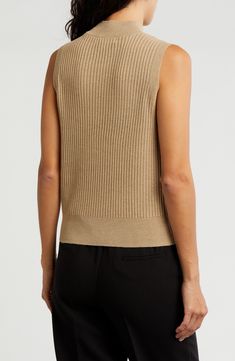 Knit from soft yarns, a lightweight, refined mock-neck sweater is a luxe layering option when the temperature starts to drop. Mock neck Sleeveless 92% polyester, 8% metallic fibers Machine wash, dry flat Imported Spring Turtleneck Knit Top For Layering, Textured Knit Tank Top For Fall, Turtleneck Knit Top For Spring Layering, Fall Ribbed Vest For Layering, Fall Textured Knit Tank Top, Beige Pointelle Knit Sweater Vest For Layering, High Neck Ribbed Knit Top For Layering, Ribbed High Neck Knit Top For Layering, Classic Spring Mock Neck Top For Layering