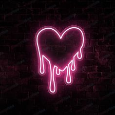 a neon heart shaped sign with dripping liquid on it in front of a brick wall