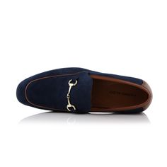 Step into timeless elegance with our suede loafers. Featuring a stylish buckle ornament, these shoes can offer both comfort and charm for any occasion. Brand: Ferro Aldo Apron toe loafer with buckle along the top Easy slip-on access Memory foam insoles for added comfort Upper: Synthetic Suede Lining: Microfiber Elegant Suede Monk Strap Shoes For Business, Office Slip-on Loafers With Tang Buckle, Elegant Suede Monk Strap Slip-on Shoes, Suede Slip-on Loafers With Buckle Closure, Suede Buckle Closure Slip-on Loafers, Formal Flat Loafers With Buckle Closure, Blue Slip-ons With Suede Lining For Formal Occasions, Elegant Blue Slip-ons For Work, Elegant Slip-on Loafers With Metal Pin Buckle