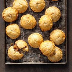 several small pies on a metal tray