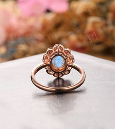 We are jewelry artisans and manufacturers. Every Jewelry is made from the very scratch, and made by hand and carefully polished especially for you. OUR ITEM DESCRIPTION ✦ Handmade, high-quality item! Metal type and purity: Solid 10k/ 14k/ 18k rose & white yellow gold ◆ Center Stone ◆ * Type: Natural Labradorite * Stone Cut: Oval Cut, 6x8mm * Total Carat Weight: 1.50ctw ◆ Side Stones ◆ * Type: Simulated Diamond/ Moissanite (Choose in Material Option) & Natural Pearl * Stone Cut: Round Cut Pink Gem Ring, Opal Promise Ring, Morganite Wedding Rings, Vintage Style Wedding Rings, 14k Rose Gold Wedding Ring, Emerald Wedding Rings, Opal Wedding Rings, Art Deco Wedding Rings, Handmade Engagement Rings