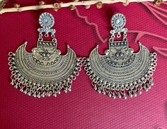 Festive Chandbali Metal Plug Earrings, Traditional Metal Earrings For Festive Occasions, Navratri Ceremonial Tilla Danglers, Traditional Festive Metal Earrings, Tilla Danglers For Ceremonial Navratri, Metal Chandbali Danglers For Pierced Ears, Metal Chandbali Chandelier Earrings For Celebration, Ceremonial Chandbali Metal Earrings, Temple Jewelry Festival Earrings With Latkans