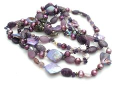 Vintage Statement Jewelry - This is a substantial four strand bead necklace with shell, pearl, agate, amethyst, crystal, charoite beads and sterling silver spacers, bead caps and clasp. It is 20" long, approximately 1.75" wide, weighs 175 grams and hallmarked TS-151 Mexico 925. Purple Agate Gemstone Beaded Necklace, Purple Amethyst Crystal Necklace With Faceted Beads, Luxury Amethyst Purple Beaded Necklaces, Elegant Purple Agate Beaded Necklace, Purple Amethyst Necklace With Faceted Beads, Vintage Statement Jewelry, Sterling Necklaces, Bead Caps, Statement Jewelry