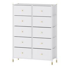 a white cabinet with gold handles and drawers