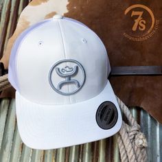 Hooey white camo logo cap. Sweat and water resistant odessa fabric. Subtle white camo pattern. Raised silver punchy logo. Adjustable snap back. White mesh back. Western Life, White Camo, Snap Back, White Mesh, Snap Backs, Odessa, Riding Helmets, Camo, Water Resistant