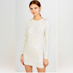 Light Weight Crepe With Sequin Embellishments Subtle Pearlescent Finish Long Sleeve With Hidden Zip Closure Mini Dress Cut Dry Clean Great Condition Elegant Long Sleeve Sequin Dress For Festive Occasions, Chic Long Sleeve Sequin Dress For Wedding, Chic Long Sleeve Dresses For Festive Occasions, White Long Sleeve Glamorous Dress, Glamorous White Long Sleeve Dress, Chic Sequin Dress For Spring Festive, White Mini Dress For Fall Wedding, Elegant Long Sleeve Sequin Dress For Spring, White Long Sleeve Festive Dress