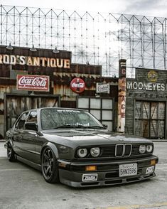 a black car parked in front of an old building