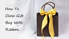 a brown bag with a yellow ribbon on it and the words how to close gift bag with ribbon