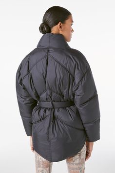 This modern puffer vest is made from 100% recycled nylon with recycled fill, combining fashion, function, and eco-friendly design. The oversize silhouette and feminine belt put a fashion-forward spin on the supremely cozy layer, making it a real hero piece in your winter wardrobe. 100% Recycled Nylon Dry Clean Only 26" Long From Shoulder Versatile Nylon Outerwear For Work, Shrunken Sweater, Tie Up Shirt, Winter Puffer Jackets, Denim Clothing, Country Women, Puffer Jacket Women, Eco Friendly Design, Real Hero