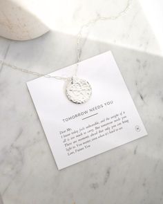 Our 'Tomorrow Needs You' necklace is a heartfelt symbol of suicide prevention and mental health awareness, reminding you that your story matters. MATERIAL 14k gold filled or .925 sterling silver Waterproof & hypoallergenic PRODUCT SPEC Charm: 3/4" disc, hand-hammered front and engraving on the back Chain: 18" modern paperclip chain with 2" extender OTHER 6 month warranty Accompanied with a matching card insert Comes in a jewelry pouch for longevity and easy gifting Empathy Cards, Back Chain, Word Bracelet, Gold Coin Necklace, Matching Cards, You Matter, Layered Bracelets, Coin Necklace, Health Awareness